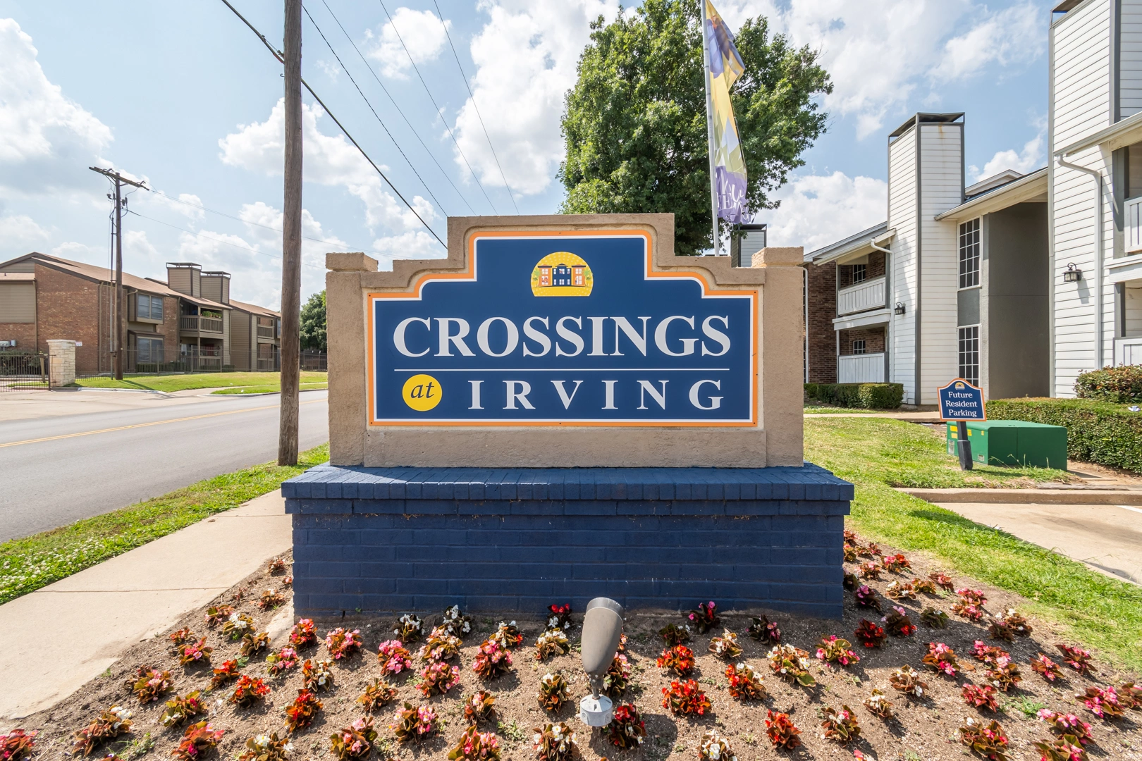 Landscaped entrance and signage at Crossings at Irving in Irving, Texas