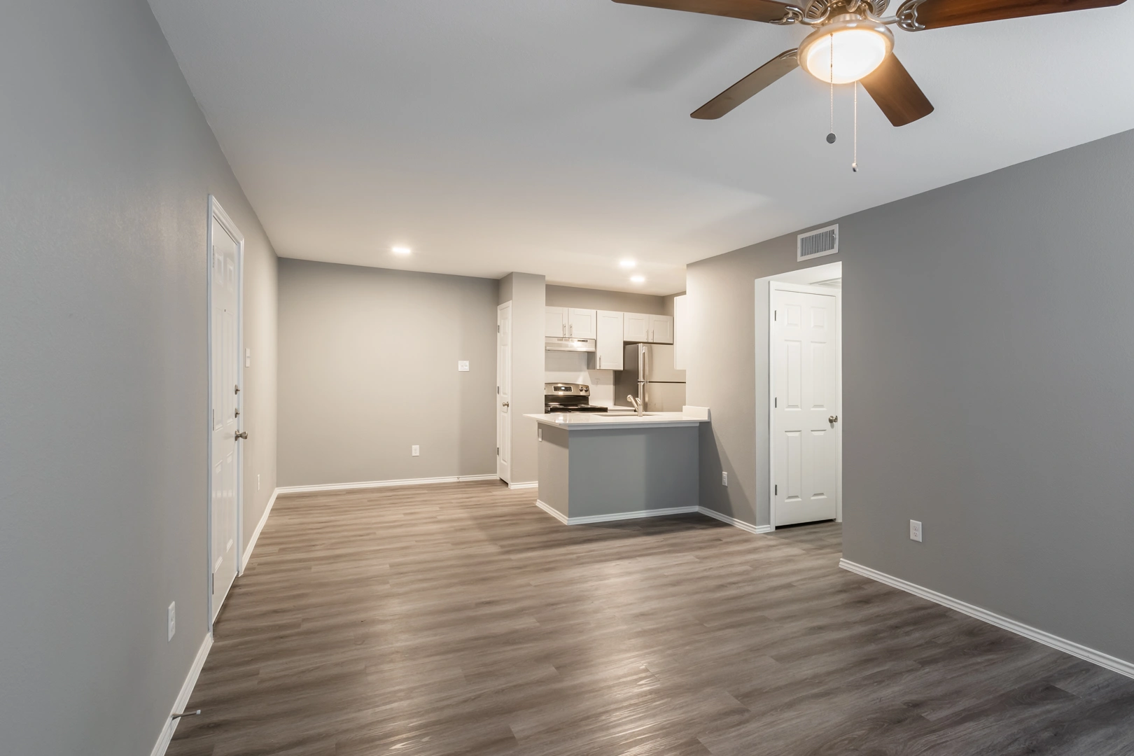 Open living and kitchen layout at Crossings at Irving in Irving, Texas