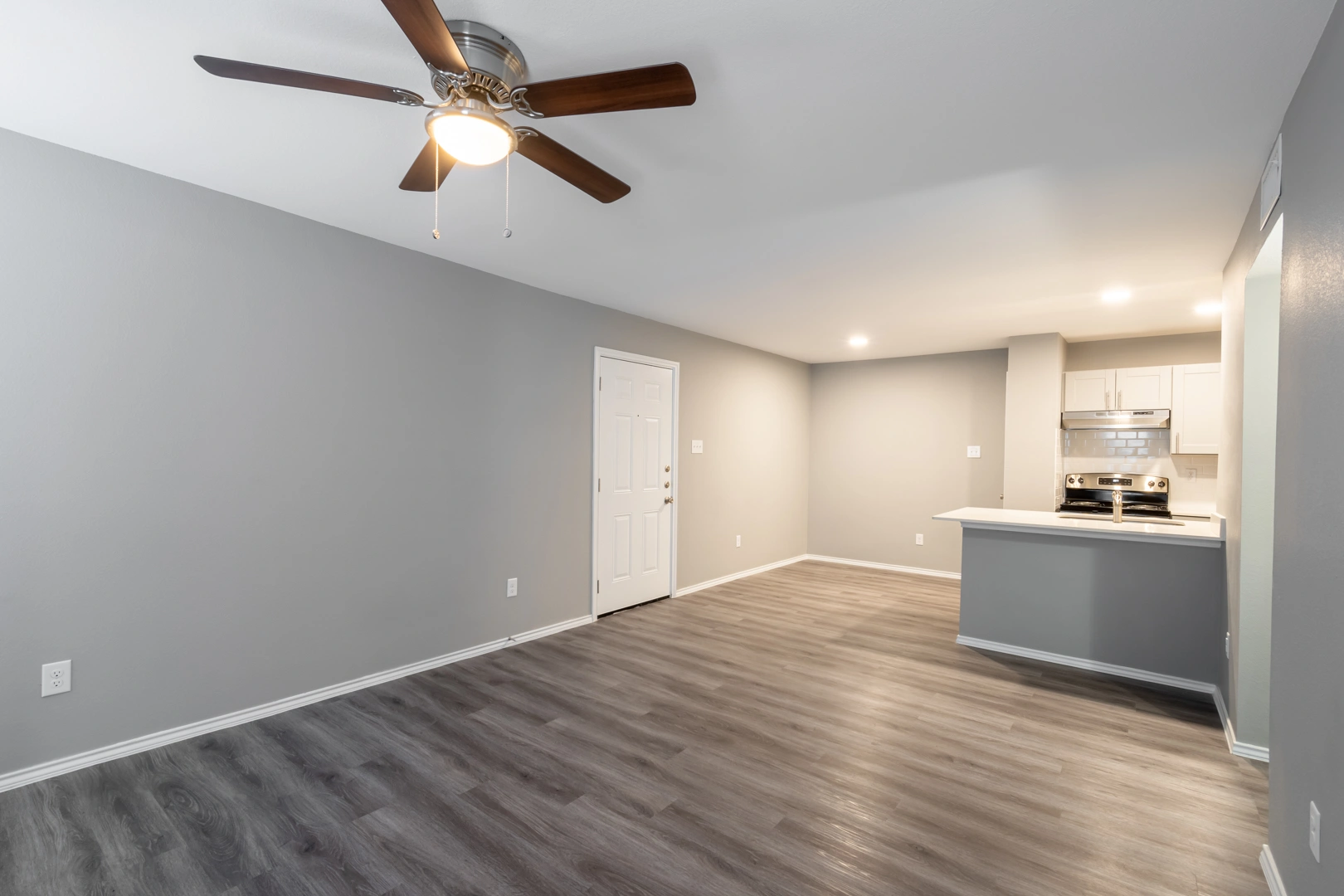 Living room and breakfast bar at Crossings at Irving in Irving, Texas