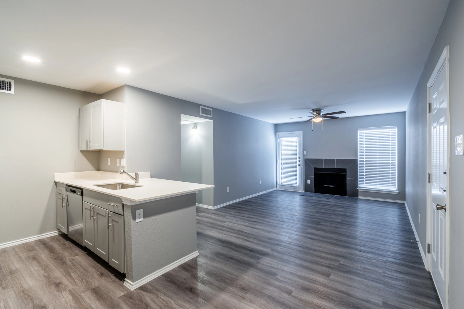 Open-concept living and modern kitchen at Crossings at Irving in Irving, Texas