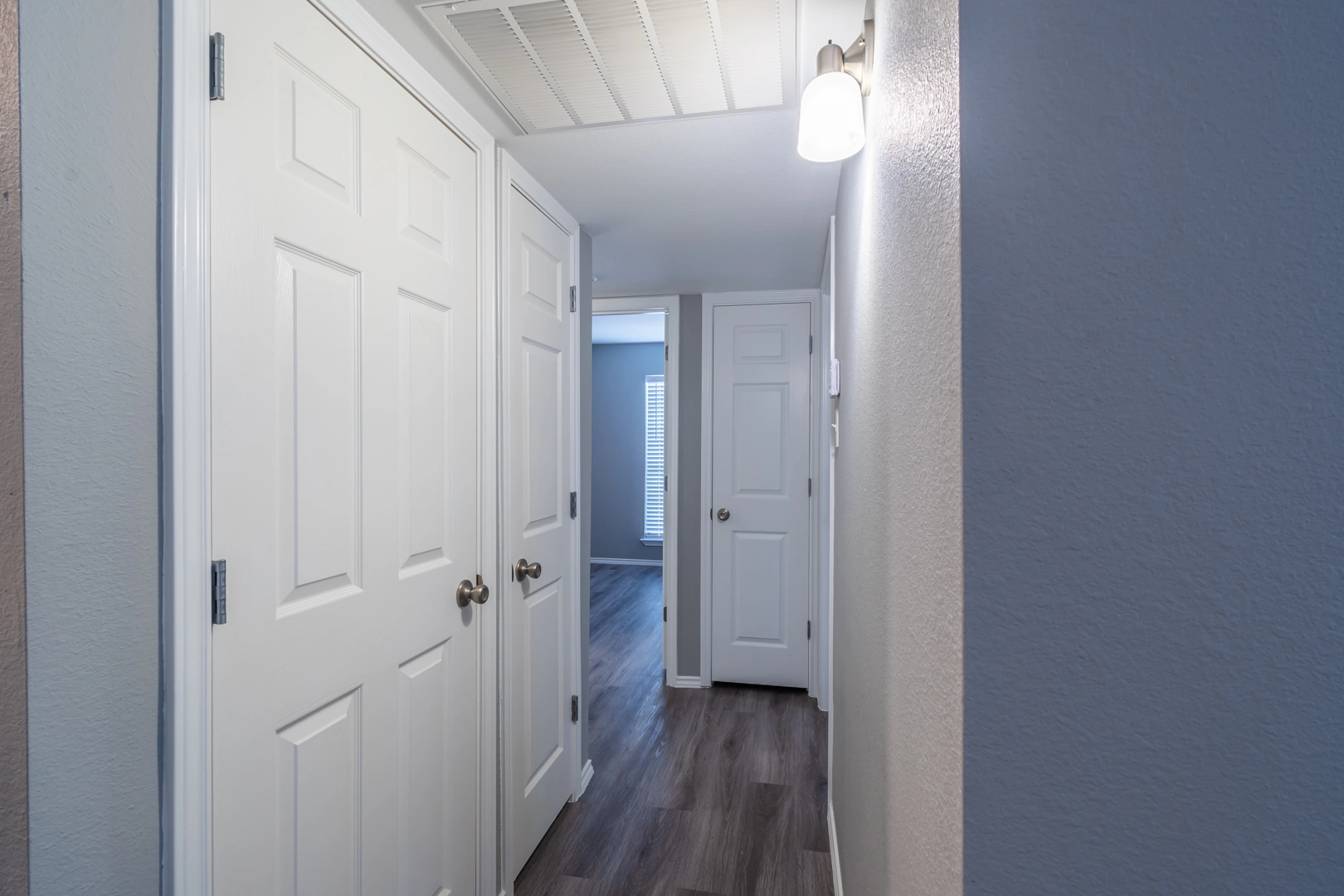 Hallway and closet storage at Crossings at Irving in Irving, Texas