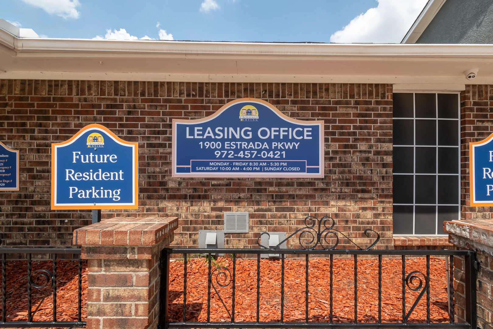 Leasing office exterior signage at Crossings at Irving in Irving, Texas