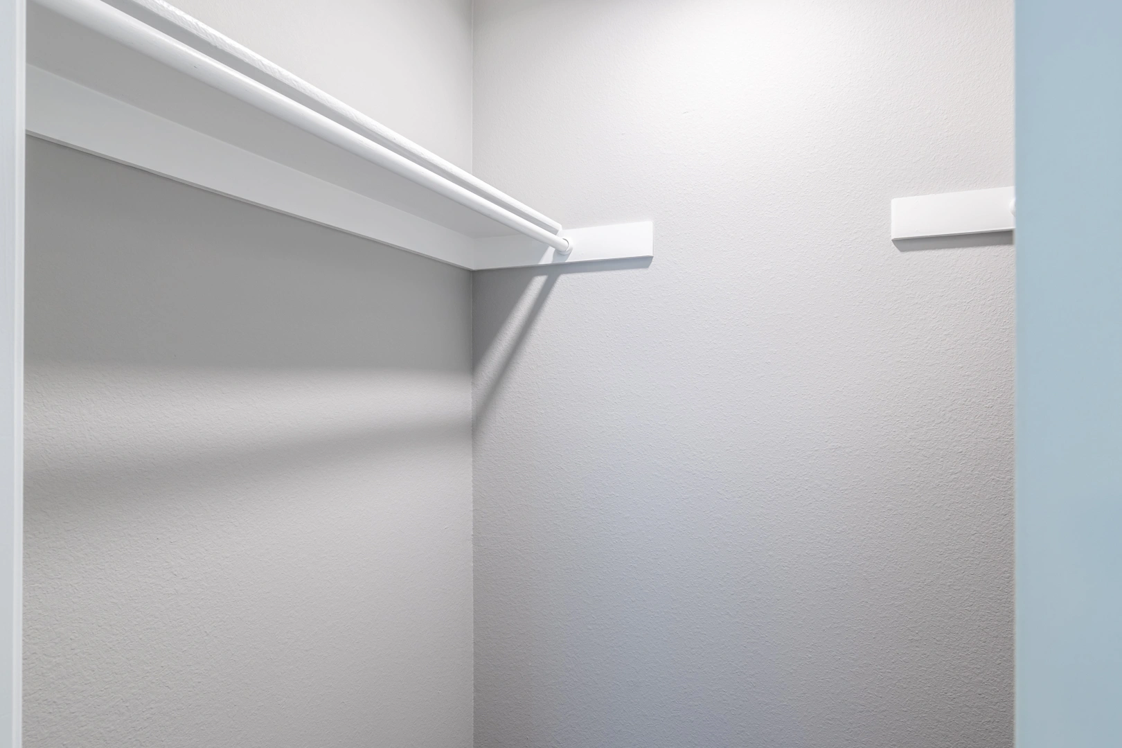 Built-in walk-in closet shelving at Crossings at Irving in Irving, Texas