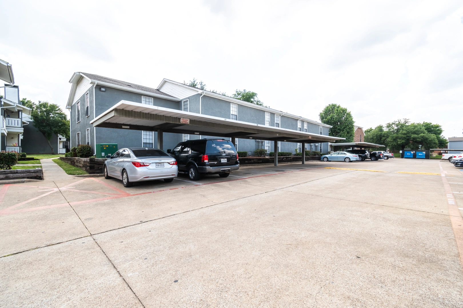 Covered resident carports and parking at Crossings at Irving in Irving, Texas
