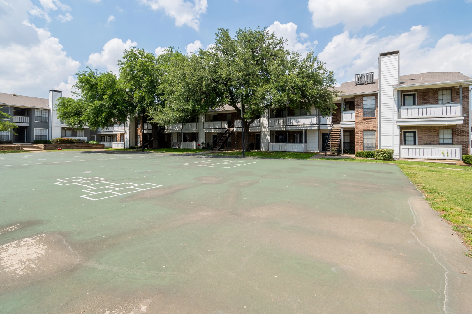Outdoor sports court and hopscotch area at Crossings at Irving in Irving, Texas